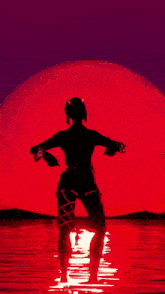 a silhouette of a woman in front of a red sun