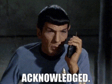 a man talking on a cell phone with the words " acknowledged " on the bottom