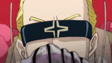 a man with a bandage around his eyes has a star on his face