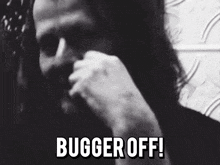 a black and white photo of a man with the words bugger off in white letters
