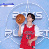 a man wearing a red basketball jersey with the number 10