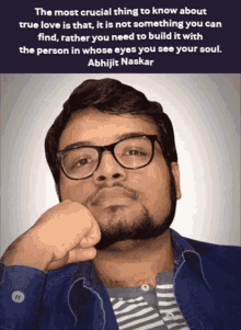 a man wearing glasses and a quote by abhijit naskar