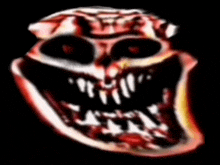a close up of a troll face with a black background