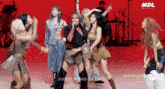 a group of girls are performing a song called justice makes me light by mdl music