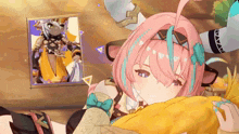 a girl with pink hair and horns is laying on a pillow