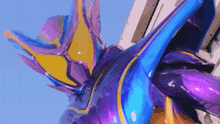 a close up of a purple and blue statue