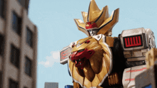 a robot with a lion 's head has a red and white stripe on the side