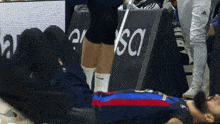 a man is laying on the floor in front of a sign that says " usa "