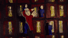 a painting of a man reading a book in front of a wall