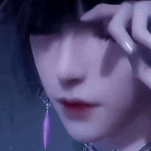 a close up of a person 's face with a purple feather earring