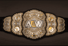 the aew wrestling championship belt is shown on a black background