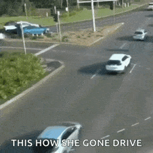 a white car is driving down a street with the words " this how she gone drive " written on the bottom
