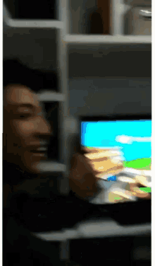 a blurry picture of a person playing a video game on a computer