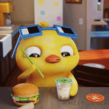 a yellow duck wearing sunglasses is eating a hamburger