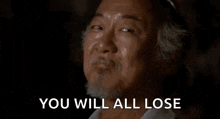 a man with a beard is smiling with the words `` you will all lose '' written below him .