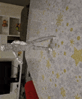 a statue of a man made of aluminum foil on a table