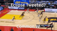 a basketball game is being played with the words " eclipse tweeted " in the corner