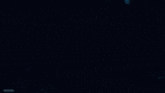 a close up of a purple and white glowing object in the dark .