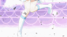 a girl with long black hair is singing into a microphone with confetti falling around her