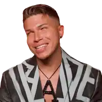 a man wearing a jacket with the letter a on it is smiling