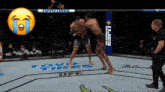 two men are fighting in a ufc ring with toyo tires on the floor
