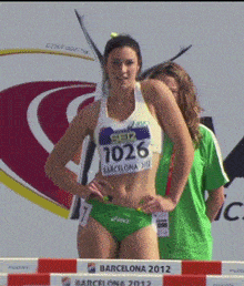a female runner wearing a number 1036 jersey