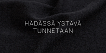 a close up of a black cloth with the words " hadassa ystava tunnetaan " on it