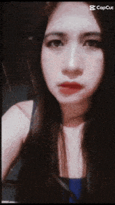 a close up of a woman 's face with a caption that says cap cut