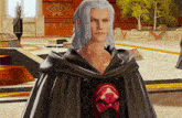a man with gray hair is wearing a black cape