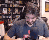 a man with a beard wearing a t-shirt that says ' iber ' on it