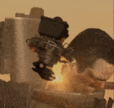 a man 's head is being destroyed by a robot