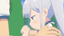 a girl with white hair and blue eyes is covering her face