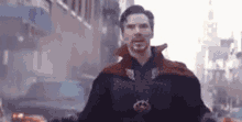doctor strange is standing in the middle of a city street .