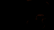 the letter jr is lit up in orange against a dark background