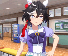 a girl is standing in front of a bulletin board that says ura