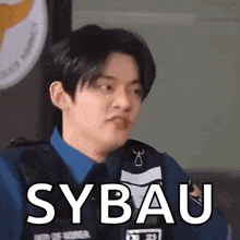 a man in a police uniform is making a funny face and the word sybau is on the screen .