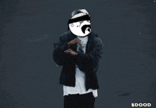 a man wearing a black jacket and a white t-shirt with a picture of a man on it is dancing