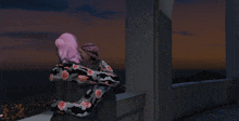 a woman with pink hair is hugging another woman on a balcony at night