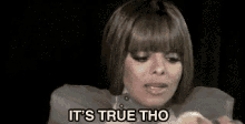a woman is eating a slice of apple and says `` it 's true tho '' .