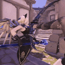 a person is holding a bow and arrow in a video game while standing next to a building .