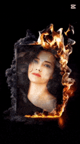 a woman 's face is surrounded by flames and smoke and says capcut
