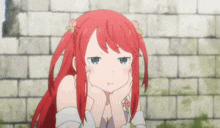 a girl with red hair is sitting in front of a brick wall with her hands on her chin .