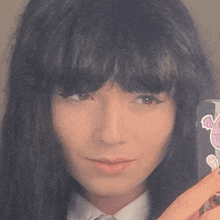 a close up of a person 's face with a sticker on it that says " i love you "
