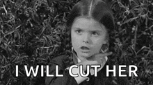 a black and white photo of a girl pointing at the camera with the words `` i will cut her '' written below her .