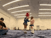 a man taking a picture of two women in a room
