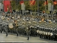 a large group of people marching down a street
