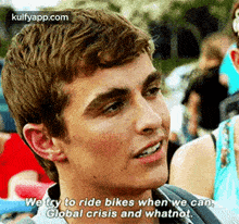 a young man is talking about riding bikes when we can , global crisis and whatnot .