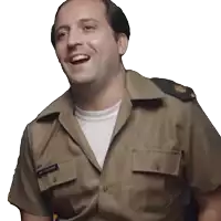 a man in a military uniform has a name tag on his pocket that says ' will comerford '