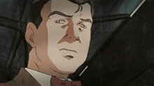 a close up of a man 's face with a bow tie on