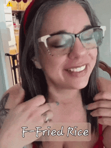a woman wearing glasses with the words f-fried rice written on her chest